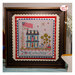 The completed Home of the Free cross stitch pattern framed and surrounded by coordinating décor. 