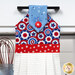 A close up shot of the top of the hanging towel, showing details on the patriotic fabrics.