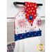 A close up shot of the top of the hanging towel, showing details on the patriotic fabrics.