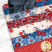 A close up on the patchwork of the mat, demonstrating details on the red, white, and blue fabrics.