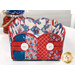 A shot of the side of the Basket, showcasing the fabric prints and colors as well as the button details.