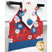 A close up shot of the top of the hanging towel, showing details on the patriotic fabrics.