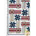 A closer look at the patchwork of the quilt, demonstrating creative woven layout and fabric colors.