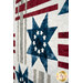 A angled super close up on one of the star block centers, demonstrating details on the laser cut star cutouts.
