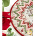 A stylized close up on the topper, demonstrating fabric prints and colors; poinsettias peek in from the right side.