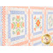An angled close up on the patchwork of the quilt, demonstrating fabric colors and print details.