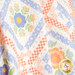A close up shot of the draped quilt, demonstrating flow and form.