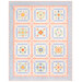 The completed Baltimore Quilt colored in soft blues, peach pinks, and cream fabrics from the Pastel Prairie collection from Moda Fabrics, isolated on a white background. 