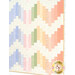 A close up on the patchwork of the quilt, demonstrating fabric color and print details.