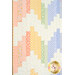 A close up on the patchwork of the quilt, demonstrating fabric color and print details.