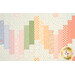 A close up on the patchwork of the quilt, demonstrating fabric color and print details.