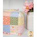 A close up of the mini charm bags, demonstrating fabric color and print details.