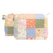The two completed Mini-Charm Bags, colored in pastel fabrics from the Pastel Prairie collection by Moda Fabrics, isolated on a white background.