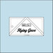 The 3" x 6" Flying Geese Ruler isolated on a blue background. 