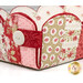 A super close up on one corner of the Basket, showcasing the fabric prints and colors as well as the button details.