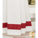 A super close up on the bottom of the towel, showing details on the towel texture and the fabric stripe.