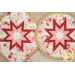 A close up on of both the round and square hot pads, demonstrating scale as well as colors and prints.