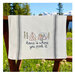 A decorative kitchen towel featuring a campsite.