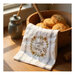 A decorative kitchen towel featuring a honeybee.
