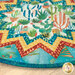 Close up on the table topper showing fabric details and colors on the folded points.