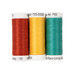 Three spools of red, yellow, and teal blue thread, isolated on a white background. 