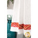 A super close up on the bottom of the towel, showing details on the towel texture and the fabric stripe.