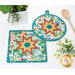 A closer look at the two Folded Star Hot Pads, demonstrating fabric color and print details.