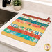 The completed Dry Ideas drying mat, colored in vibrant prints from the Desert Dreams collection by Maywood Studio, staged on a marble kitchen counter with coordinating decor.