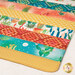 A super close up on the mat demonstrating fabric prints and color details.