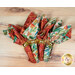 A top-down shot of the four napkins colored in the Desert Dreams collection by Maywood Studio, featuring vibrant southwest themed prints, staged on a wooden table.