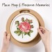 Round embroidery hoop frame with wood veneer finish with hoop placement visual.