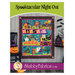 Front cover of the pattern showing the completed quilt, colored in orange, teal, green, purple, and black fabrics.