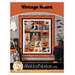 Front cover of the pattern showing the completed quilt, colored in orange, grey, and black.