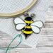 The Bee Mine needle miner displayed on a hand embroidery project.