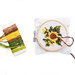 A cross-stitch hoop featuring a sunflower design, with colorful embroidery threads beside it.