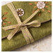 A close up on the ribbon tying the sewing roll together. 