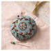 A close up on the pincushion. 