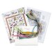 The contents of the Mermaid ABC cross stitch picture kit, including fabric, needle, hoop, floss, and the pattern.