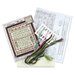 The contents of the Butterflies cross stitch picture kit, including fabric, needles, beads, floss, and the pattern.
