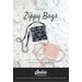 Front cover of pattern showing the completed zippy bags in two sizes, staged on a white marble countertop.