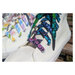 close up shot of a white sneaker with the black aglet and colorful bubble laces.