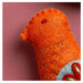 A close up on one of the folk bird ornaments.