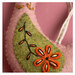 A close up on one of the folk bird ornaments.