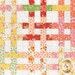 A close up on the patchwork of the quilt, demonstrating layout and fabric details.
