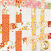 A close up on the patchwork of the quilt, demonstrating layout and fabric details.
