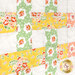 A super close up on the patchwork of the quilt, demonstrating layout and fabric details.