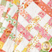 A close up on the patchwork of the draped quilt, demonstrating flow and form of the project.