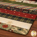 A super close up on the mat demonstrating fabric prints and color details.