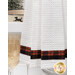 A super close up on the bottom of the towel, showing details on the towel texture and the fabric stripe.