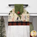 A super close up on the top of the towel, demonstrating fabric colors on the prints and fabric button.
